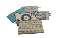 Load image into Gallery viewer, Colorful Greek-inspired patterned pouches in blue and beige, featuring eye motifs and intricate designs.