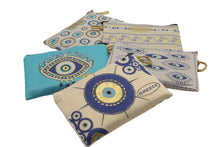 Load image into Gallery viewer, Collection of colorful patterned purse wallets featuring traditional Greek eye motifs on a white background.
